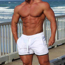 Load image into Gallery viewer, Men's Fashion Casual Sports Beach Quick-drying Solid Color Shorts